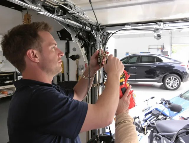 Melbourne Garage Door Repair safety certified technician performing cable replacement in Melbourne