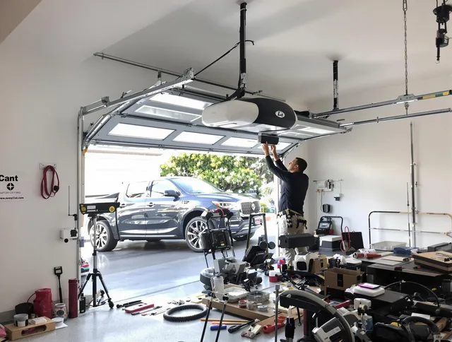 Melbourne Garage Door Repair specialist installing smart garage door opener system in Melbourne home
